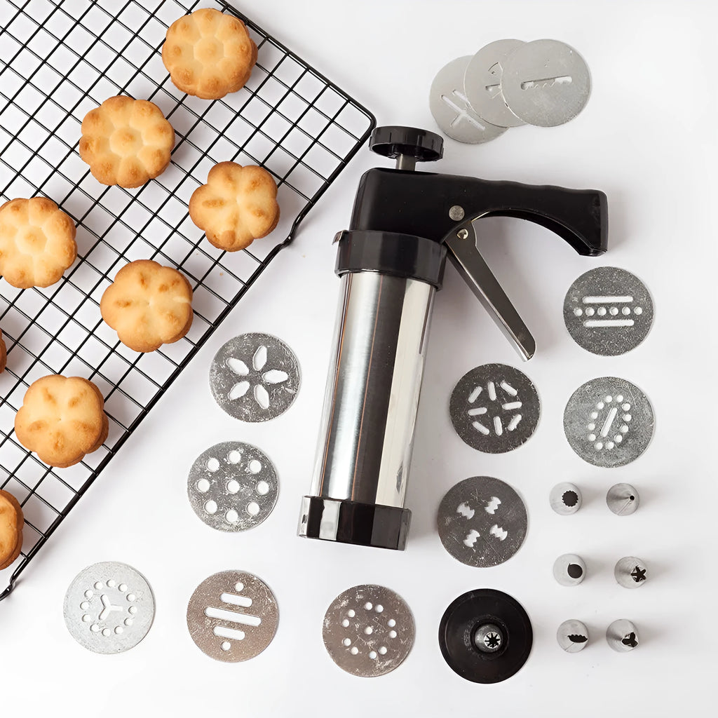 Stainless steel biscuit press cookie gun with assortment of metal cookie molds and piping nozzles