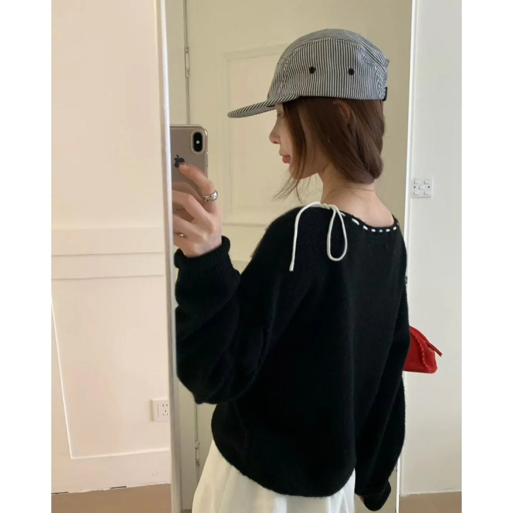 Grey loose-fitting women's long sleeve pullover made from regenerated cellulose knitwear.