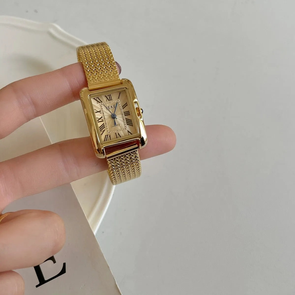 Lady's Roman retro square quartz watch with metal strap and glass face
