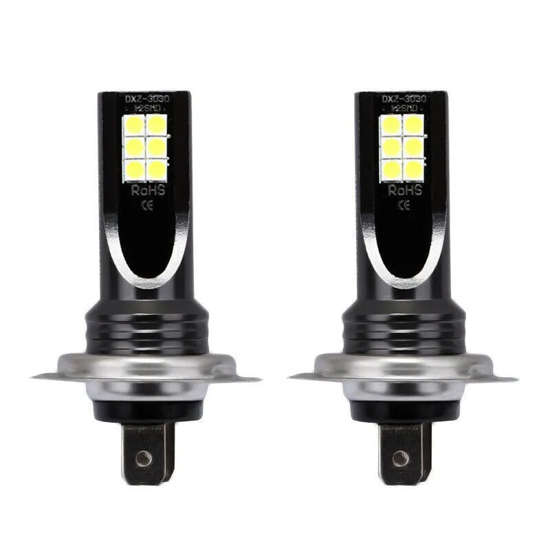 Close-up of an H7 LED fog light bulb with aluminium housing and multiple small LED chips visible.