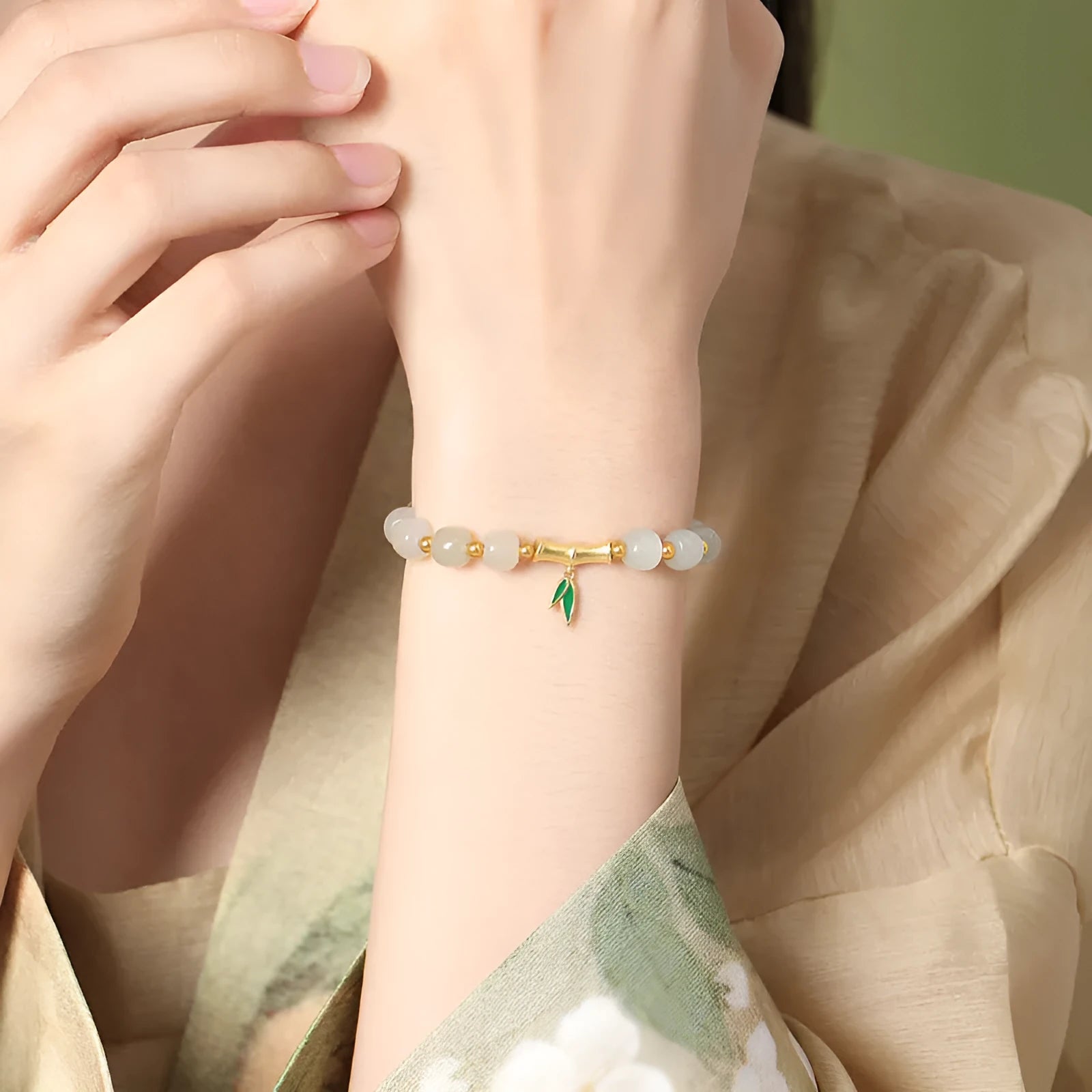 Sterling silver bracelet with natural Hetian jade bamboo leaf beads in zhizhu colour