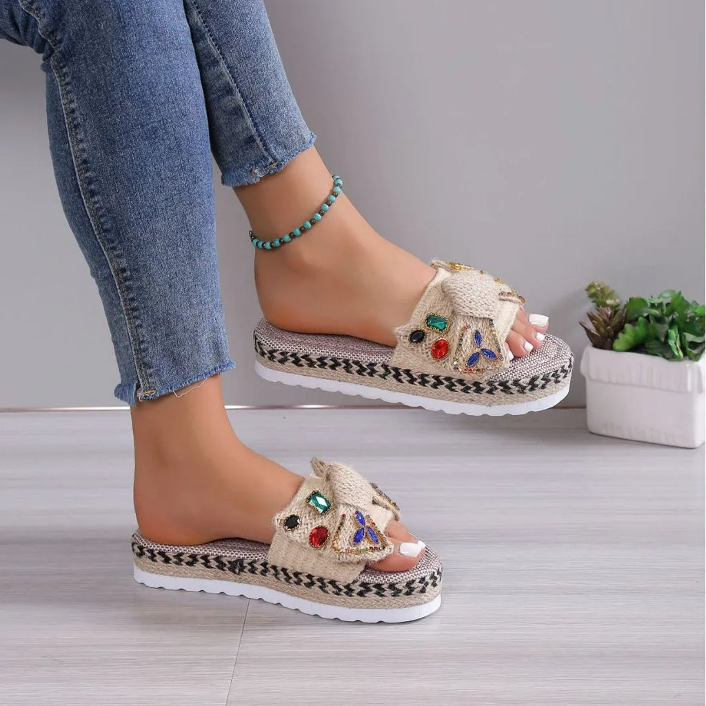 Creamy-white women's platform sandals with a cloth upper, beach bow detail, and a round toe.