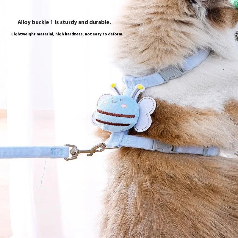 Pink, yellow, and blue bee-shaped adjustable cat leash with strap and hand rope on grass.