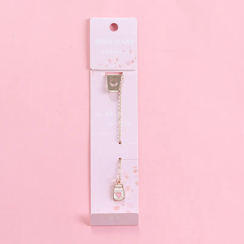 Alloy metal bookmark with cartoon pendant designs including panda, rocket and unicorn variations