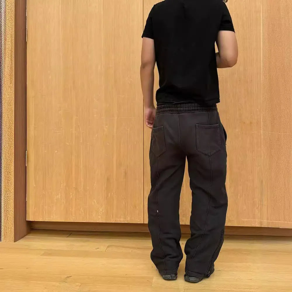 Men's loose cropped polyester sweatpants with quilted tooling style in black, grey, or green