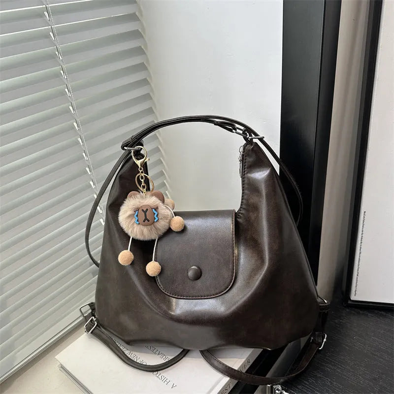 Women's horizontal square PU leather shoulder bag in urban simplicity style with single strap and internal phone pocket