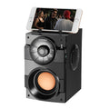 Black portable mini home audio system with subwoofer, USB cable, and 1.2m audio cable.