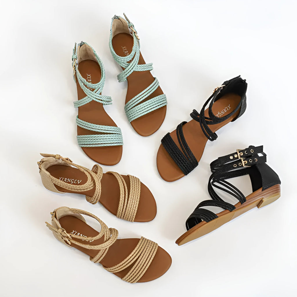 Women's light green cross-strap Roman sandals with a thick wedge sole and back zipper.