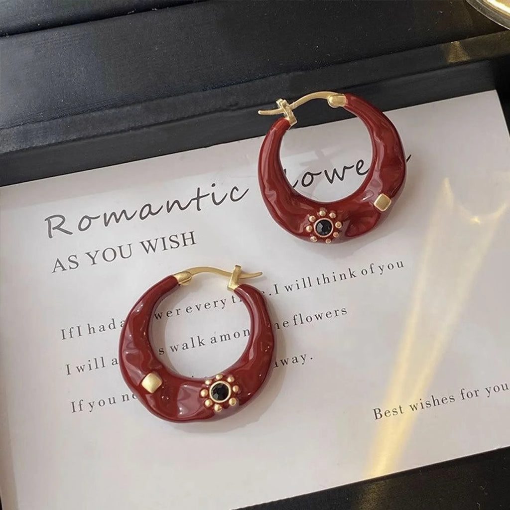 Hong Kong style retro stud earrings with dripping oil finish and rhinestone accents in black and red colours