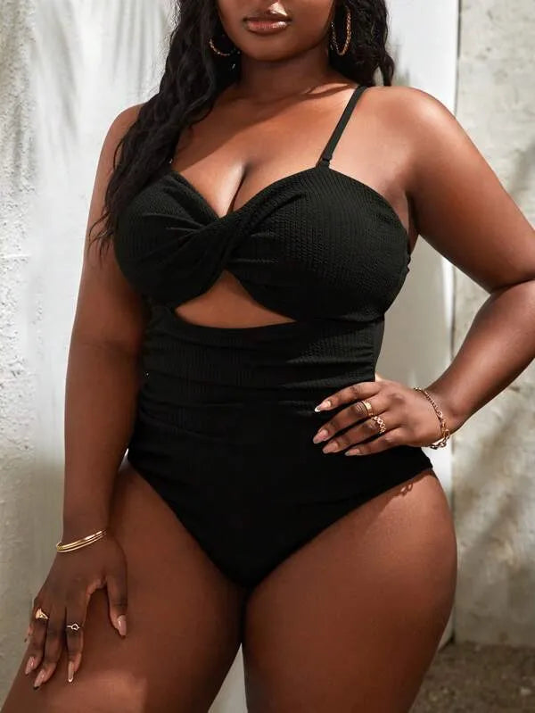 Black plus size women's slimming one-piece swimsuit with sleeveless triangle style design