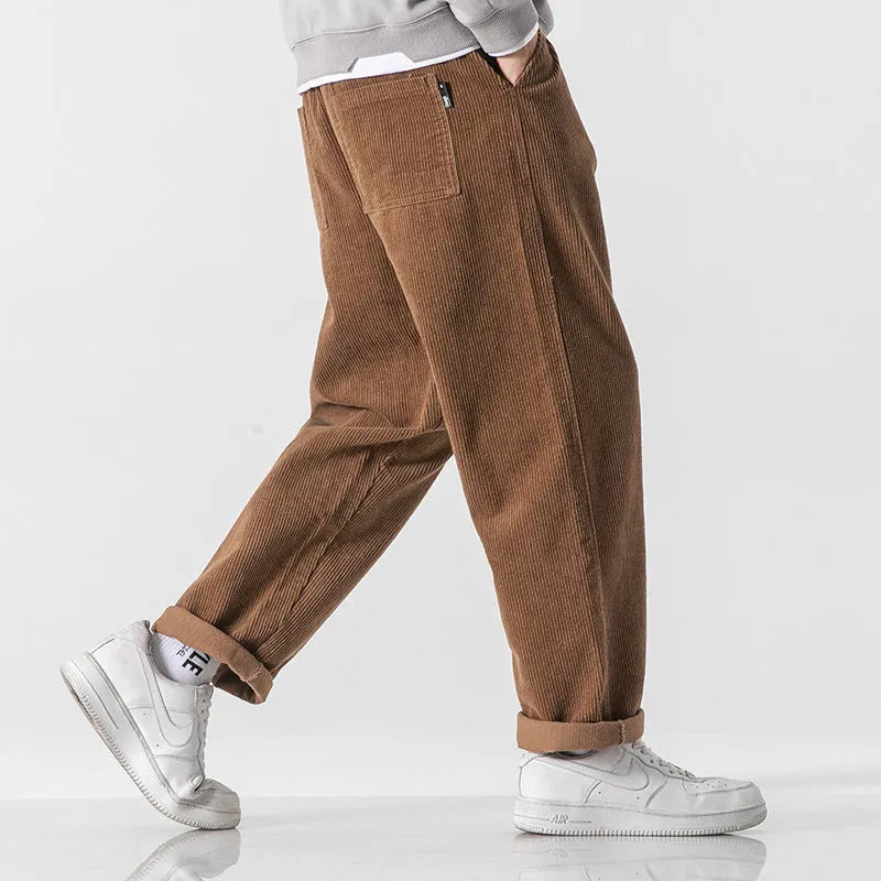 Men's loose straight corduroy sports trousers in Army Green colour showing mid-waist and full length design