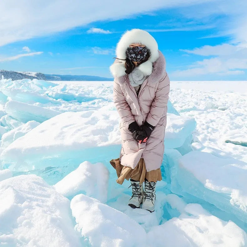 Women's black genuine leather mid-calf snow boots with a round toe and rubber sole.