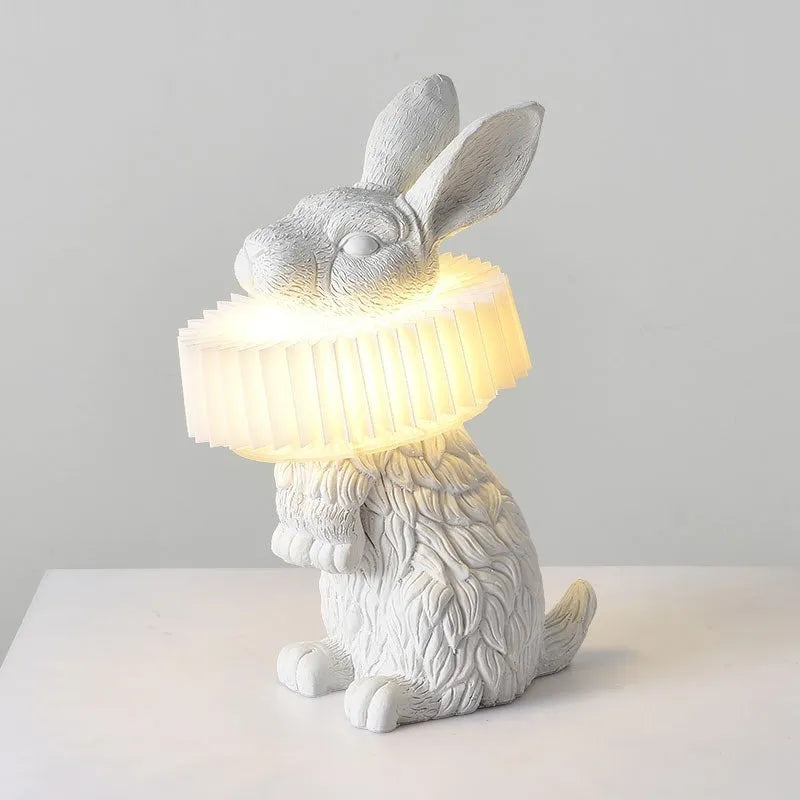 Modern customisable bedside lamp with choice of white or black rabbit silhouette designs.