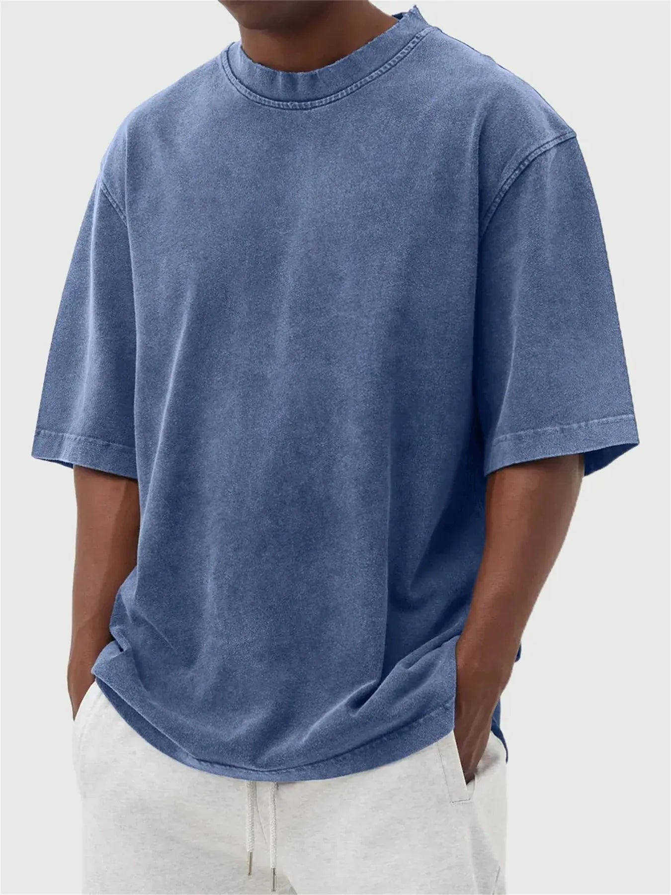 Men's stone washed loose fit t-shirt in a distressed solid colour, shown in Army Green.