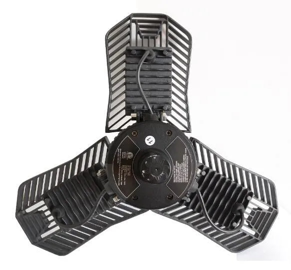 Industrial foldable waterproof LED garage lamp with die-cast aluminium housing shown in a workshop setting.