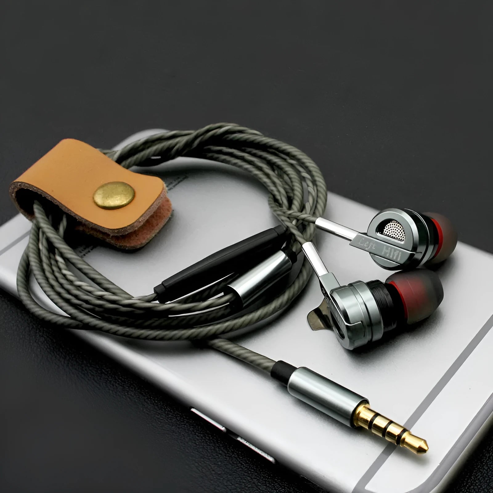 Black metal HIFI in-ear headphones with inline microphone and controls on the cable.
