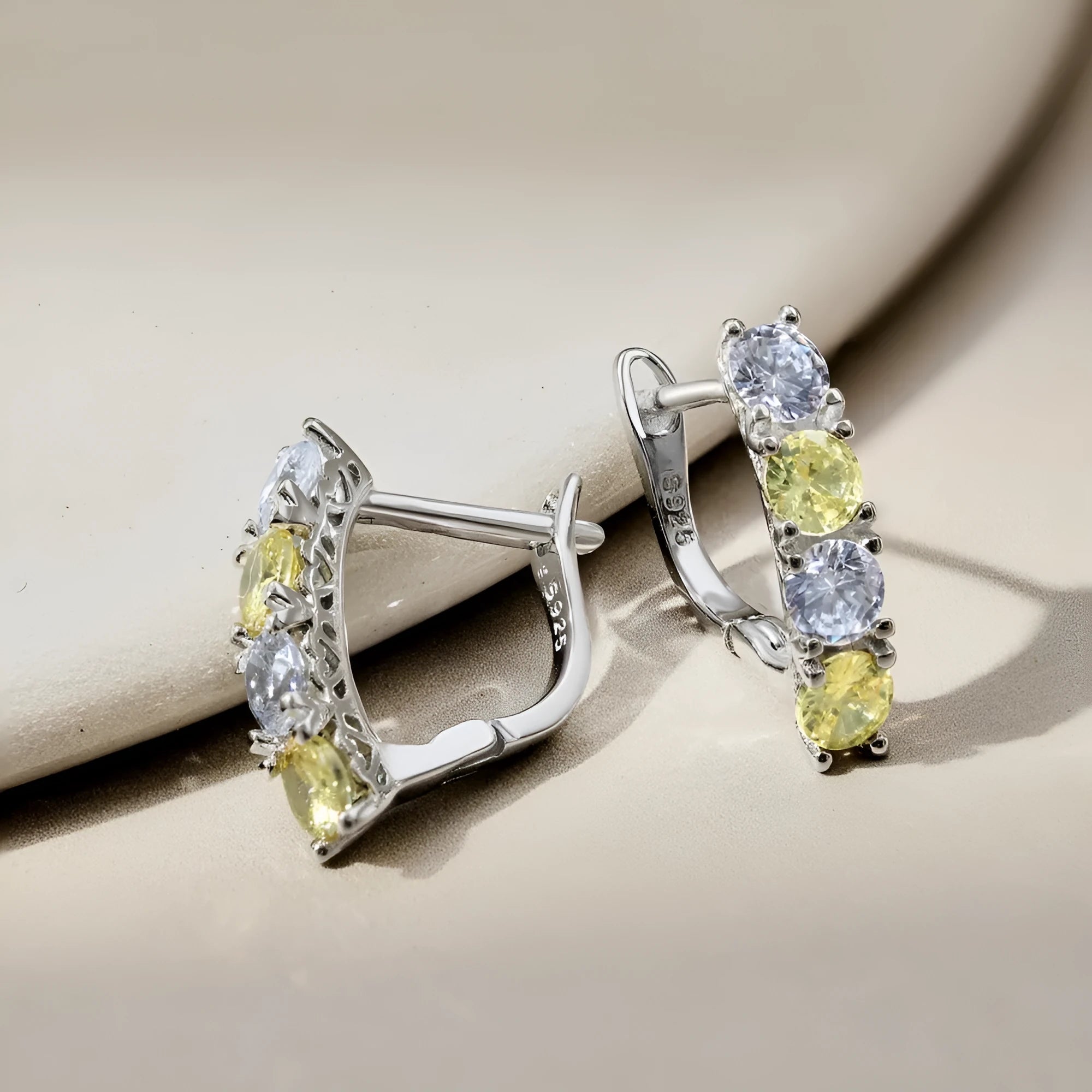 U-shaped zircon inlaid 925 silver female earrings in platinum yellow white diamond colour on white background