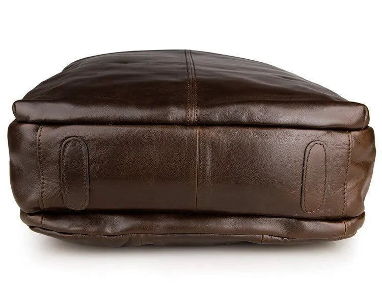 Top layer leather computer backpack in brown colour with zip closure designed to fit a 15 inch laptop