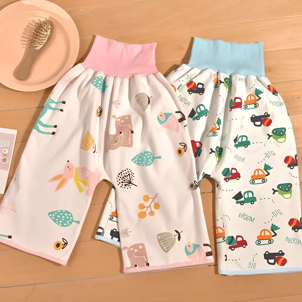 High waist baby diaper training pants in blue car cartoon print, showing elastic waistband.