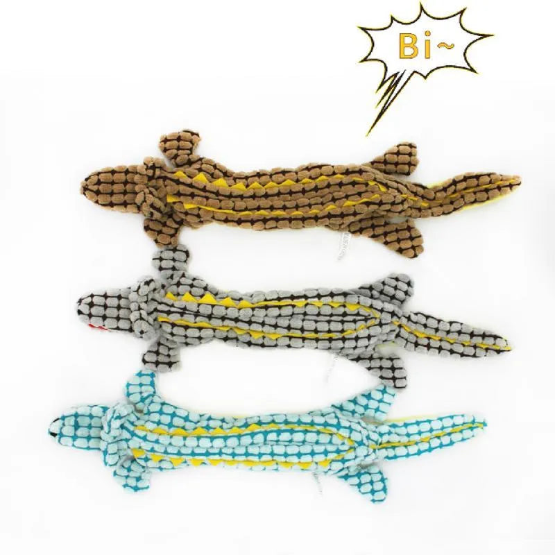 Blue crocodile-shaped plush dog toy with corduroy texture and squeaker for small and large dogs