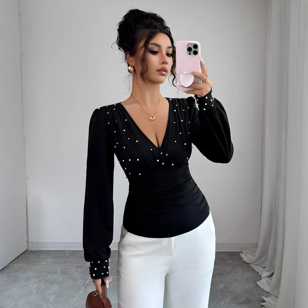 Women's V-neck solid colour fitted t-shirt with long bell sleeves in black, wine red, or apricot.