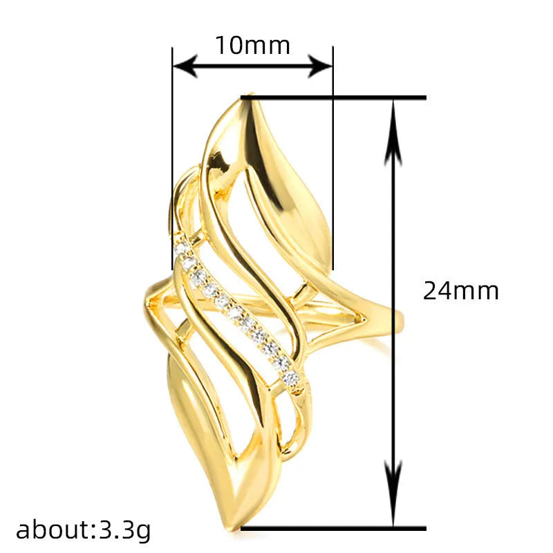 Gold coloured women's ring with an exaggerated curved design on a copper band.