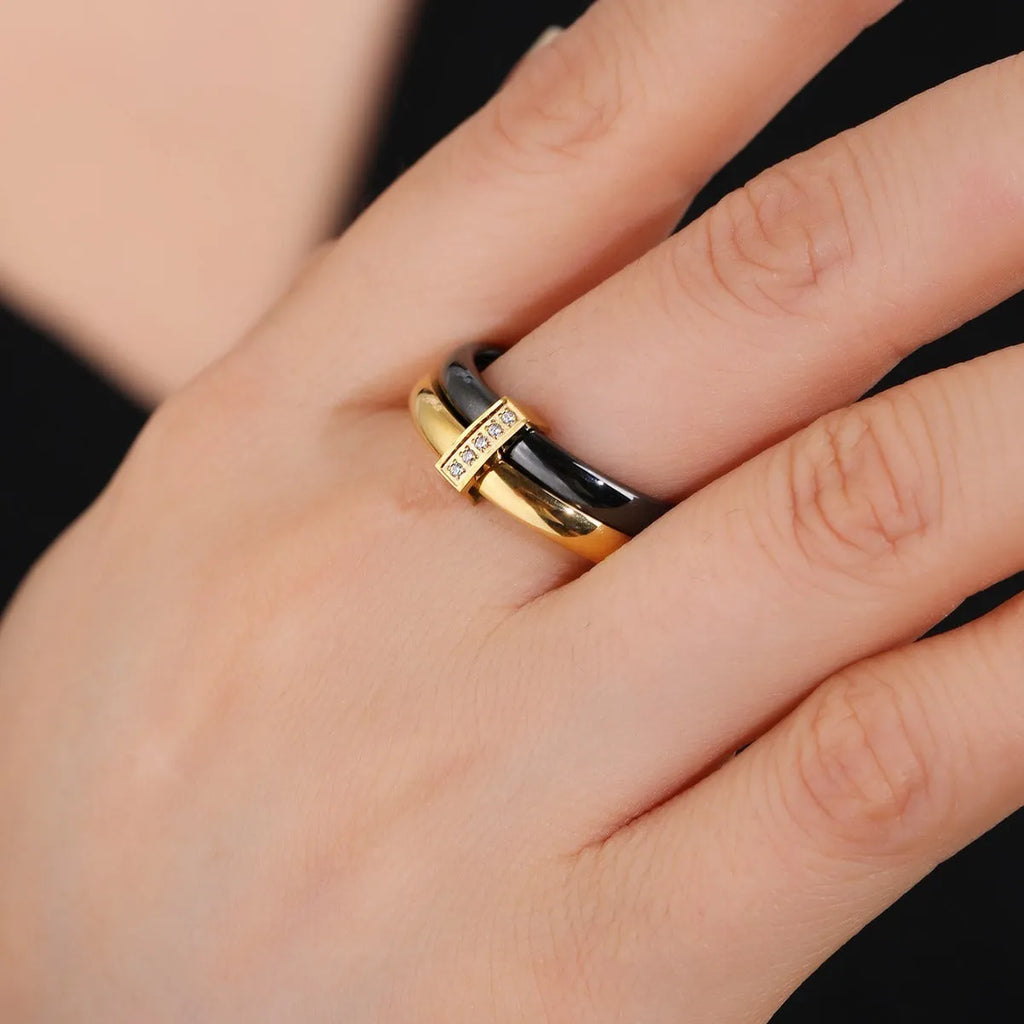 Women's heart-shaped double ring made of titanium steel with glossy stitching and zirconium inlay.