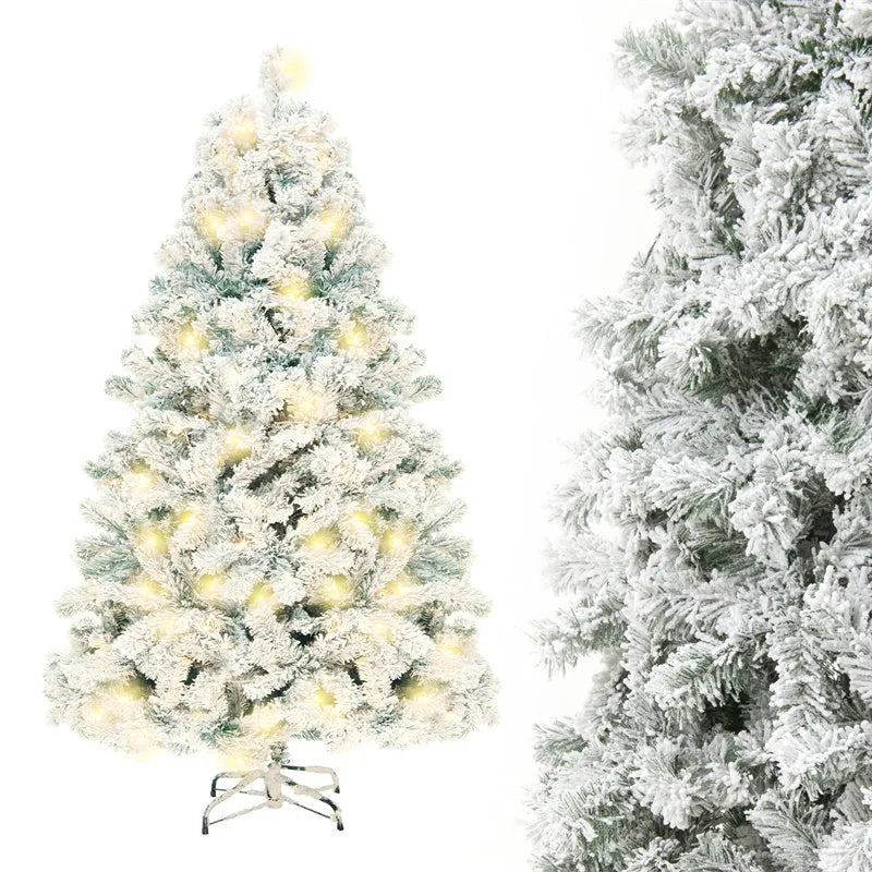 Green and white snow-dusted artificial PVC Christmas tree on a metal stand.