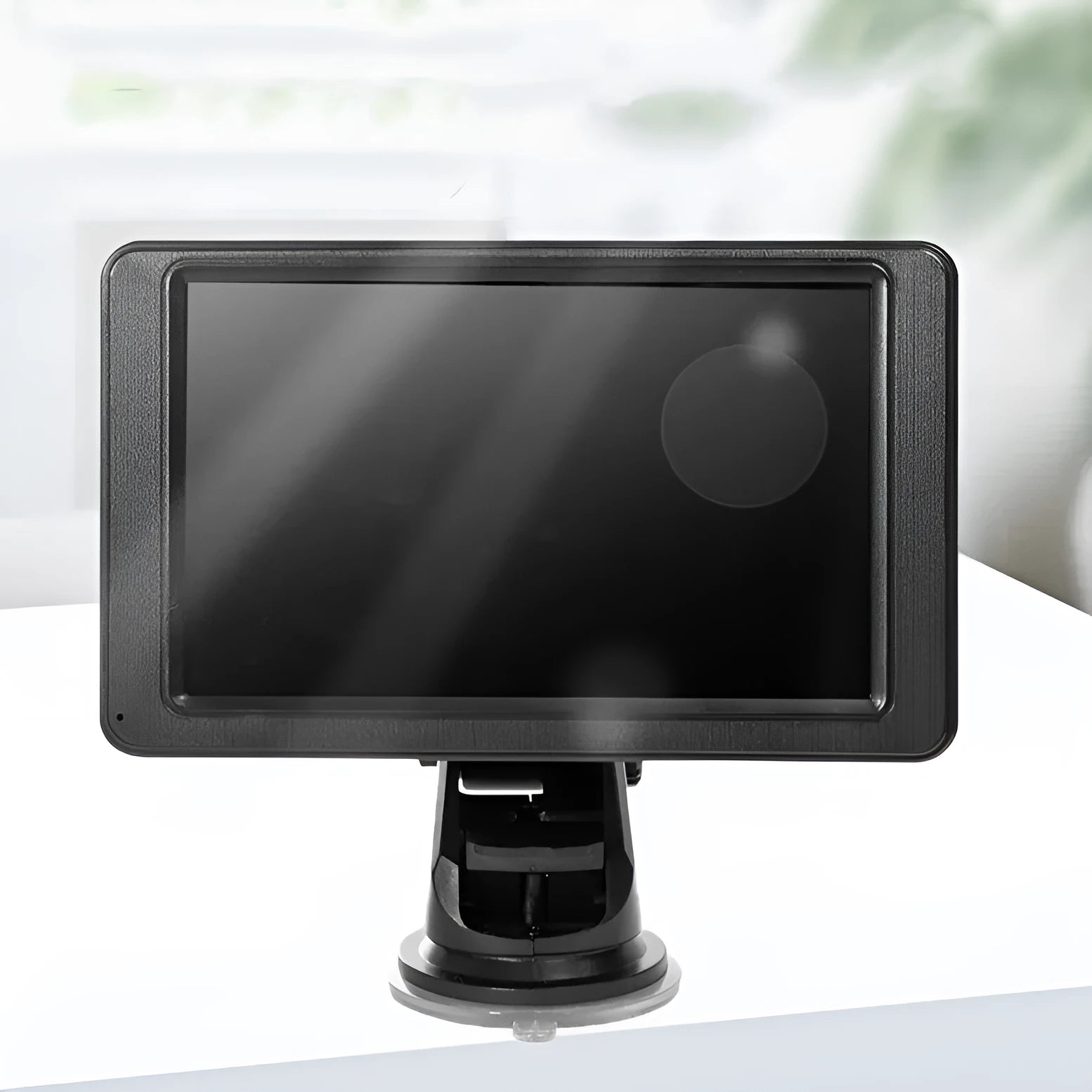 Black portable vehicle-mounted MP5 player with 7-inch LCD screen on a car dashboard bracket.