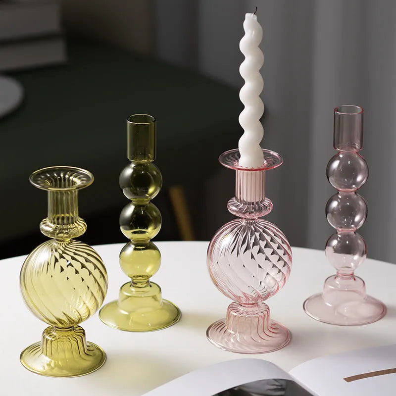Transparent borosilicate glass candle holder in Three Ball Mott design, available in brown, blue, pink, green