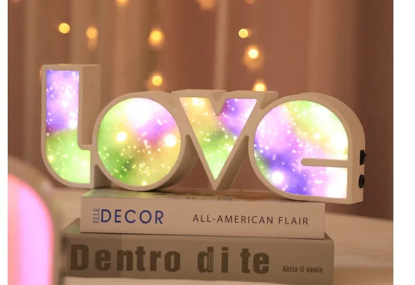 LED LOVE light decoration with rainbow-style lampshade showing romantic room illumination