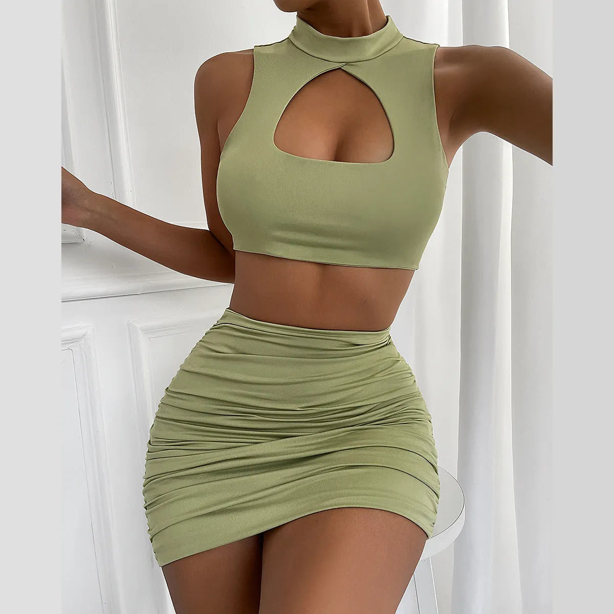 Light purple elastic polyester two-piece set with cutout vest and matching hip skirt.