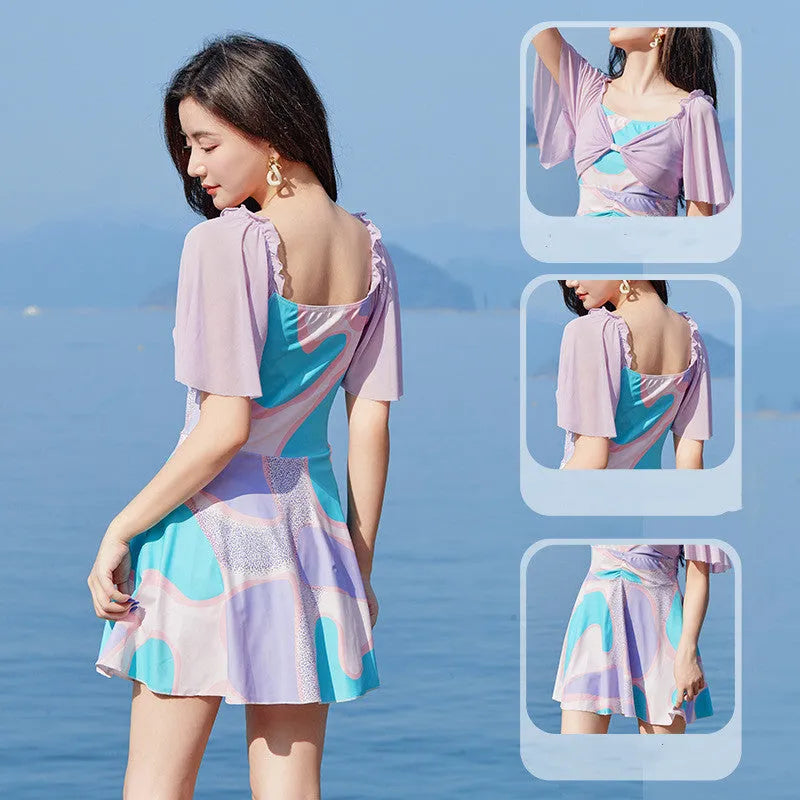 Women's high-waisted one-piece swimsuit with floral pattern in light purple or light blue colour