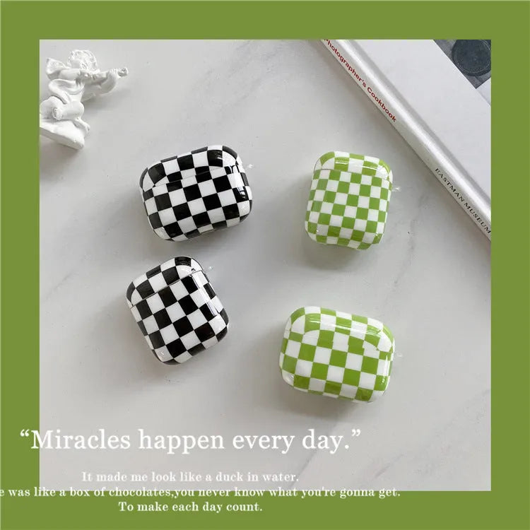Black and green checkerboard pattern TPU protective case for Apple AirPods with optional smiley face lanyard.