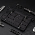 Black Oxford cloth portable outdoor kit measuring 18 by 3.5 centimetres