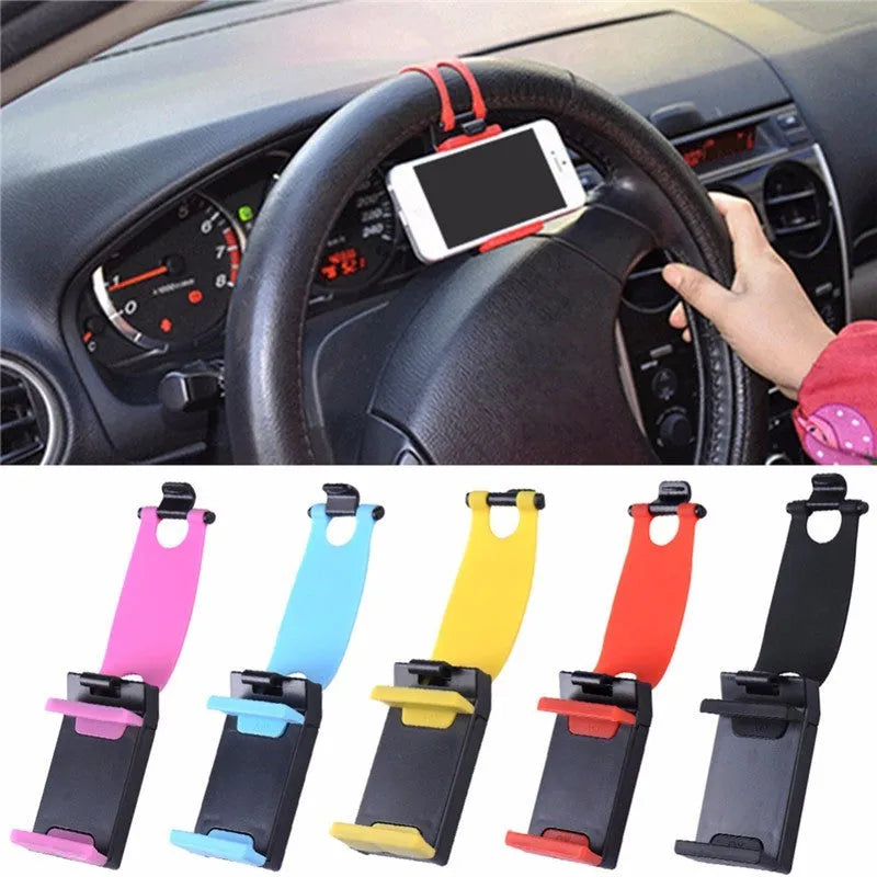 Black universal steering wheel phone clip holder with silicone pad mounted on a car steering wheel.