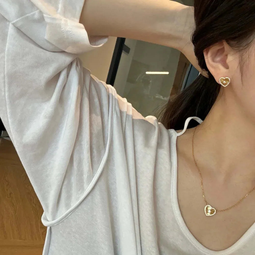 Gold colour 925 sterling silver necklace with retro heart and totem pendant on a clavicle chain