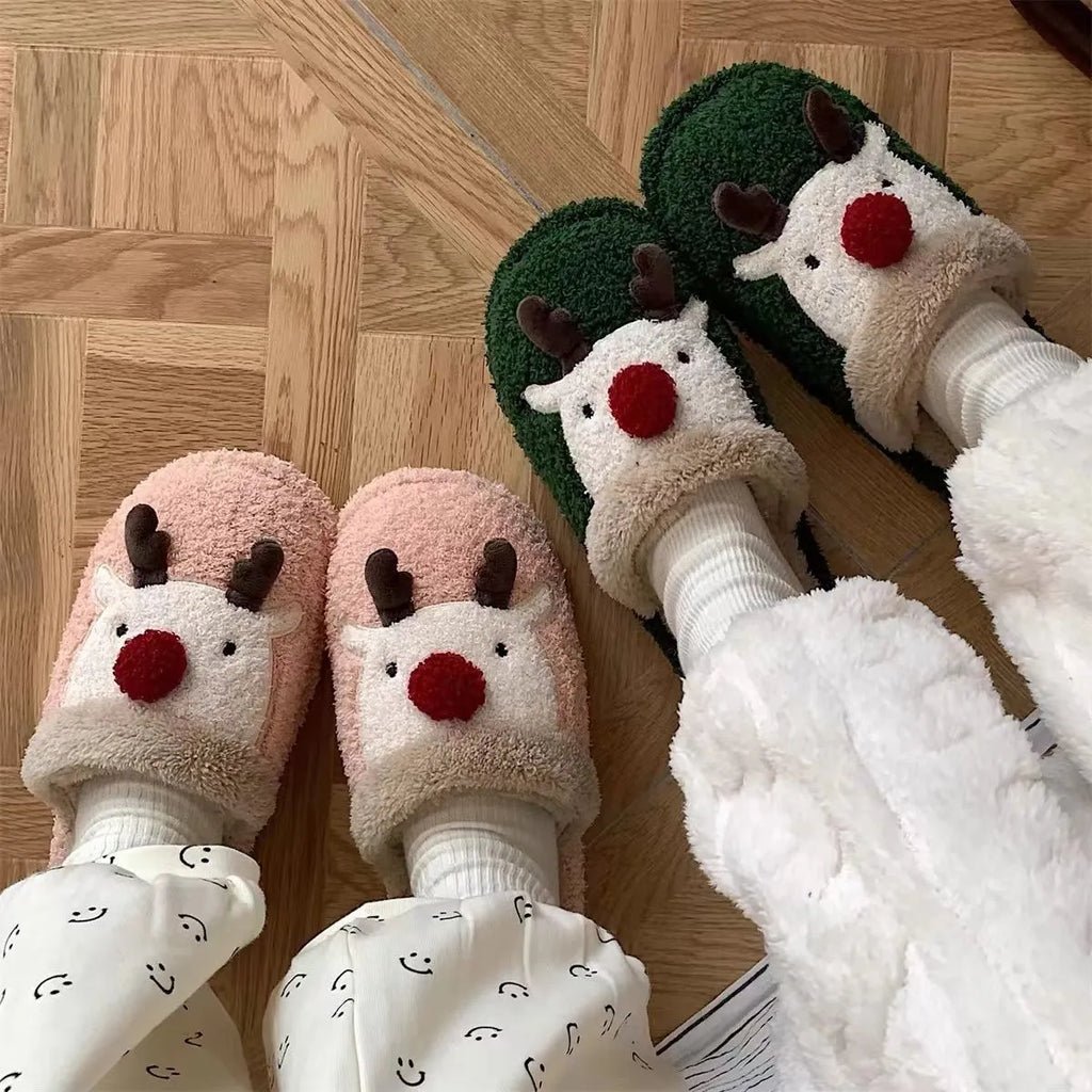 Women's green Christmas deer plush slippers with non-slip PVC soles.