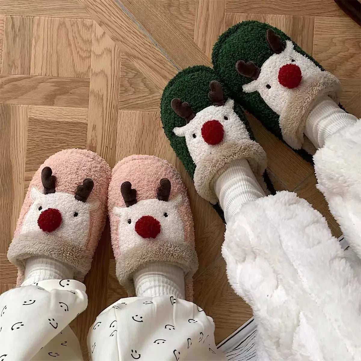 Women's green Christmas deer plush slippers with non-slip PVC soles.
