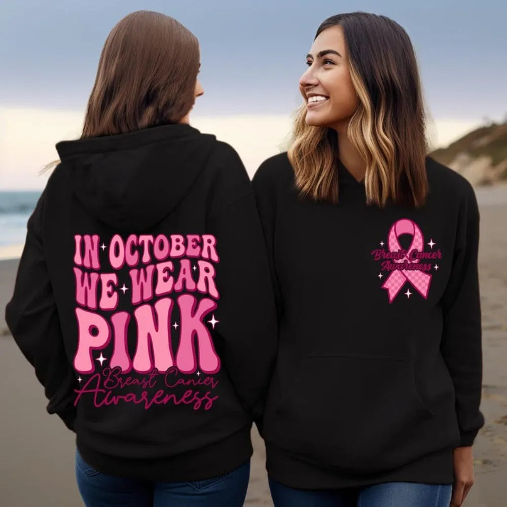 Women's pink pullover hoodie with a retro Breast Cancer Awareness print and side seam pockets.
