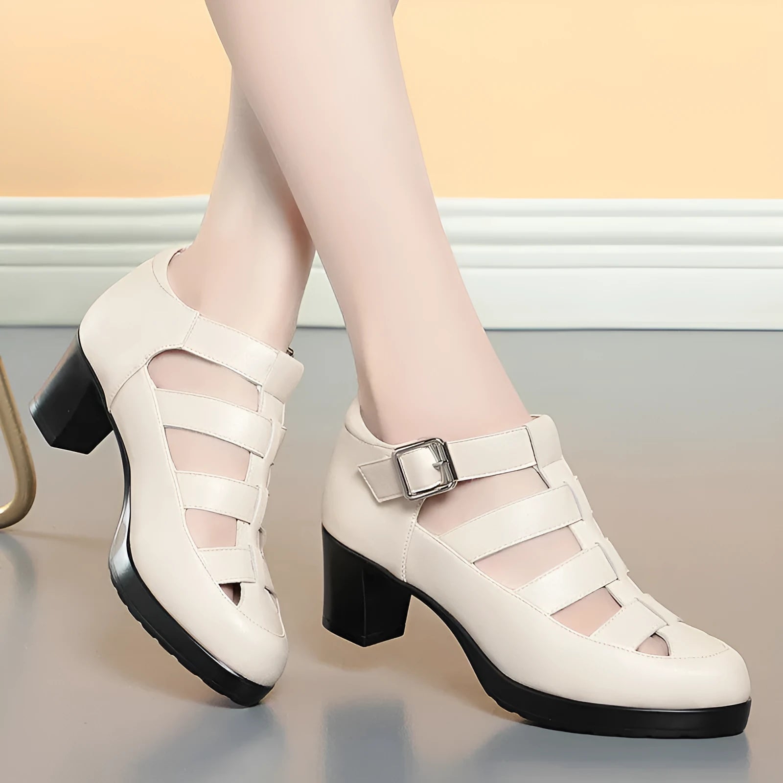 Women's closed toe sandal with chunky heel, woven upper, ankle strap, and back zipper.
