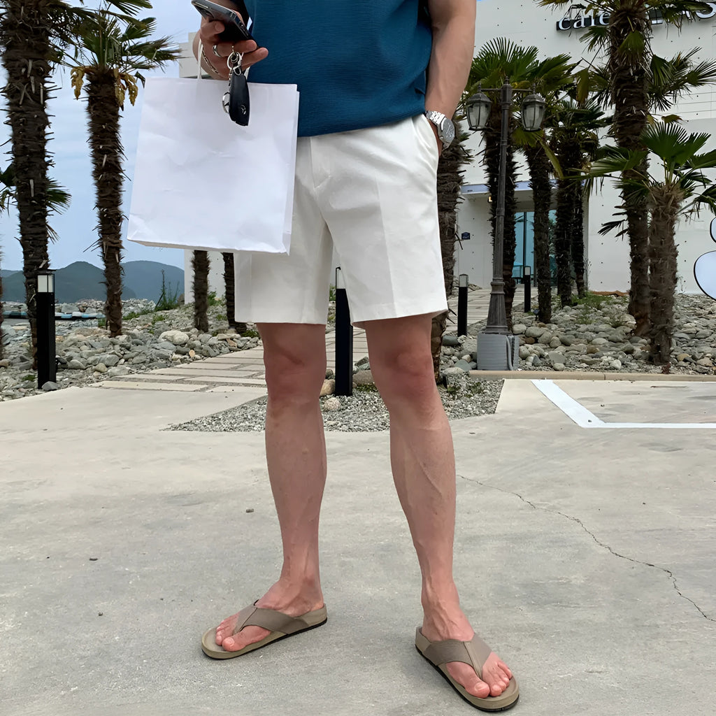 Men's straight leg casual shorts in solid colour on a hanger