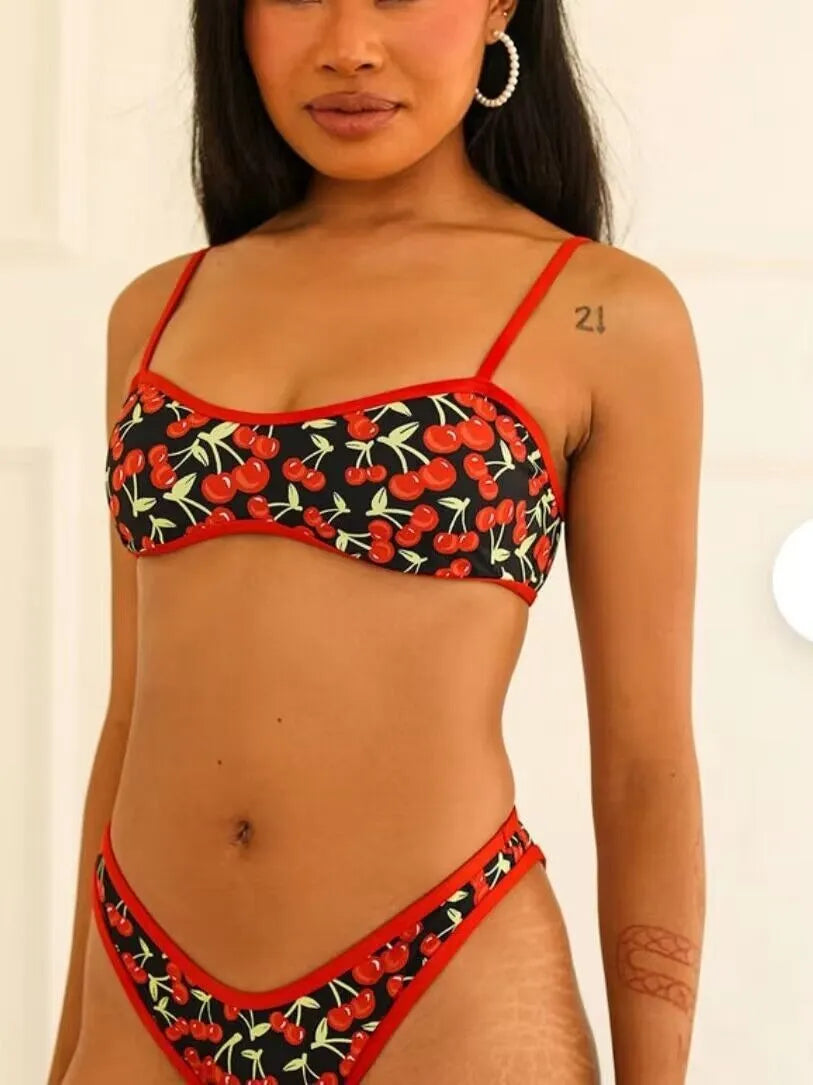Women's cherry print floral bikini swimsuit with tube top and briefs.