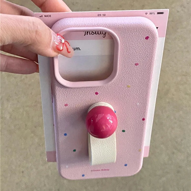Polka dot silicone phone case with finger ring, frosted finish, for iPhone, pink colour, back view