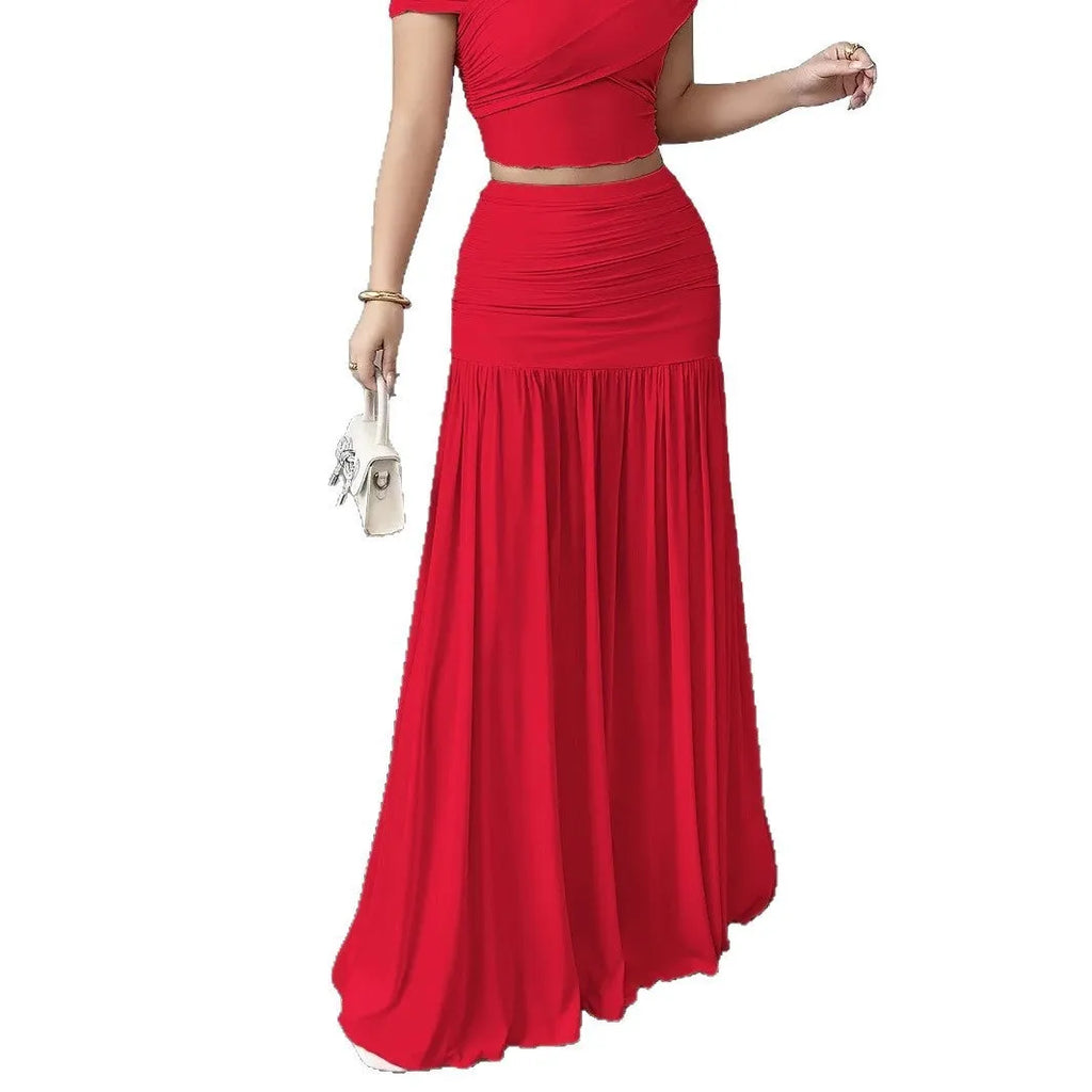 Women's pleated long skirt in polyester with irregular hem available in pink and beige sizes S to XXL