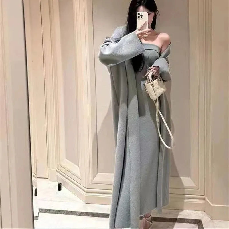 Women's grey knitted dress with matching cardigan coat, featuring regular sleeves and a long skirt.