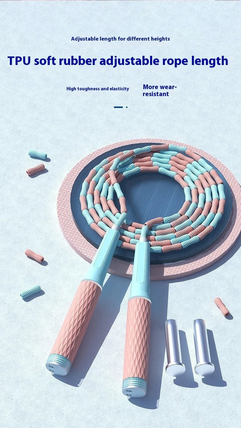 Children's skipping rope with soft blue bead handles and a non-knotted beaded cord.