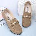 Women's black matte slip-on casual shoes with a round toe and soft rubber sole on a flat surface.