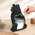 Black wooden box for storing pet grooming tools and brushes.