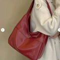 Women's soft square PU shoulder bag in retro style with open pocket and single strap.